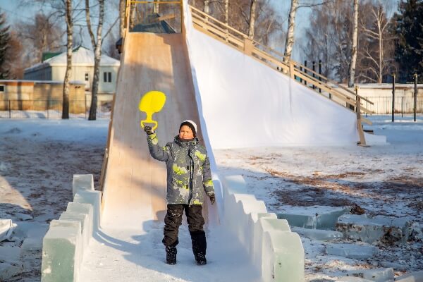 A child plays on playground equipment at home.